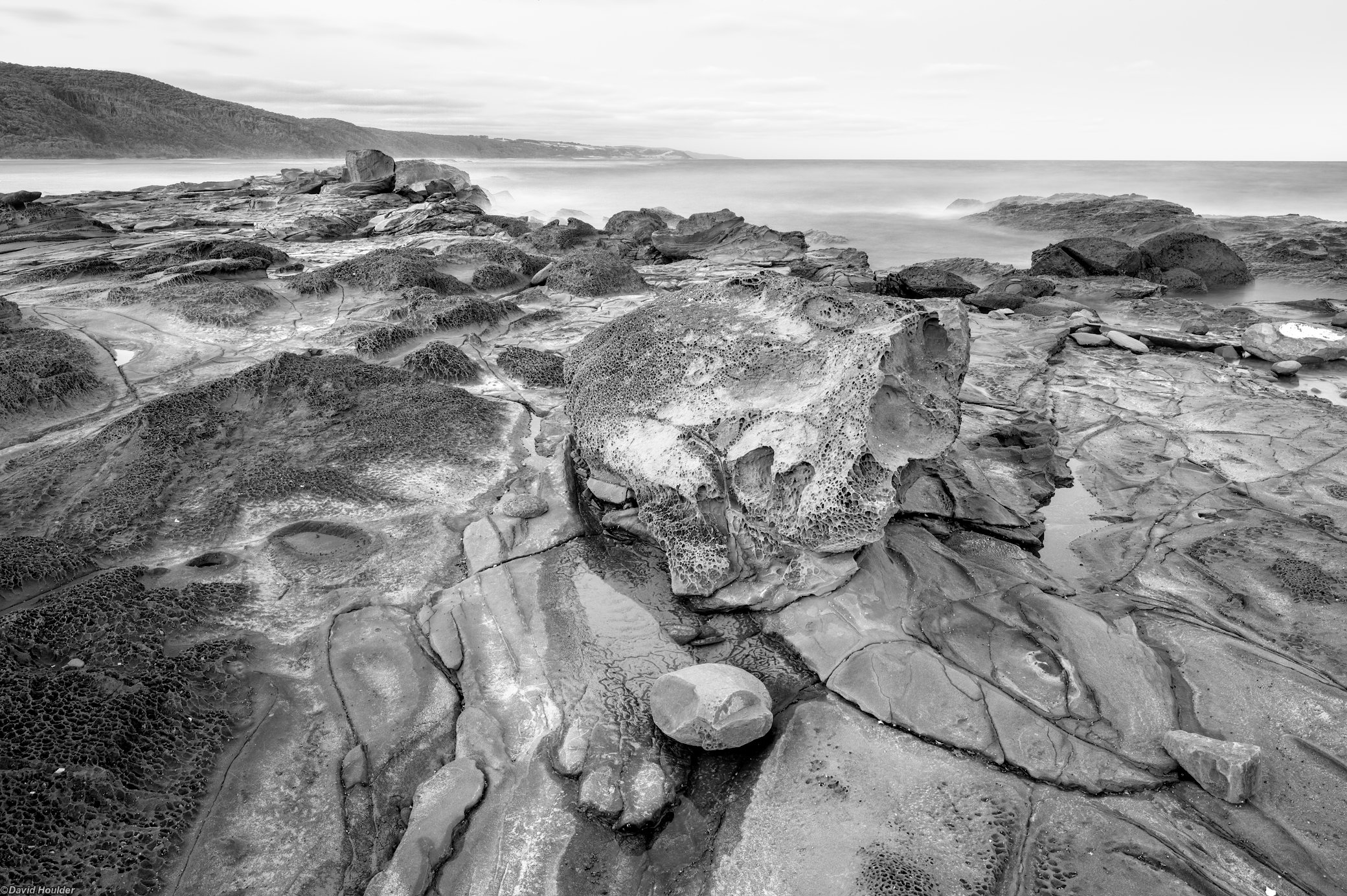 Eroded rocks on a rock shelf by the sea