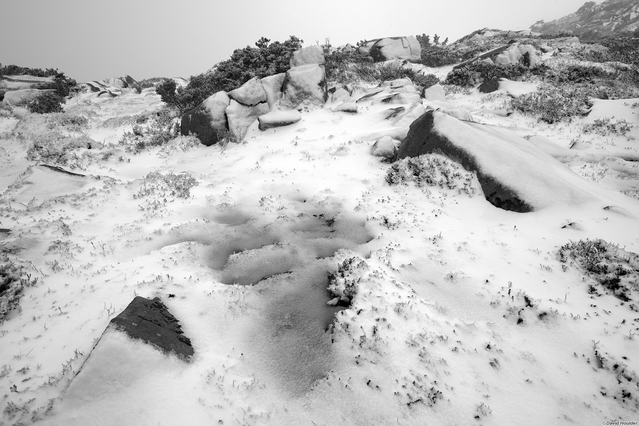 Snow on boulders