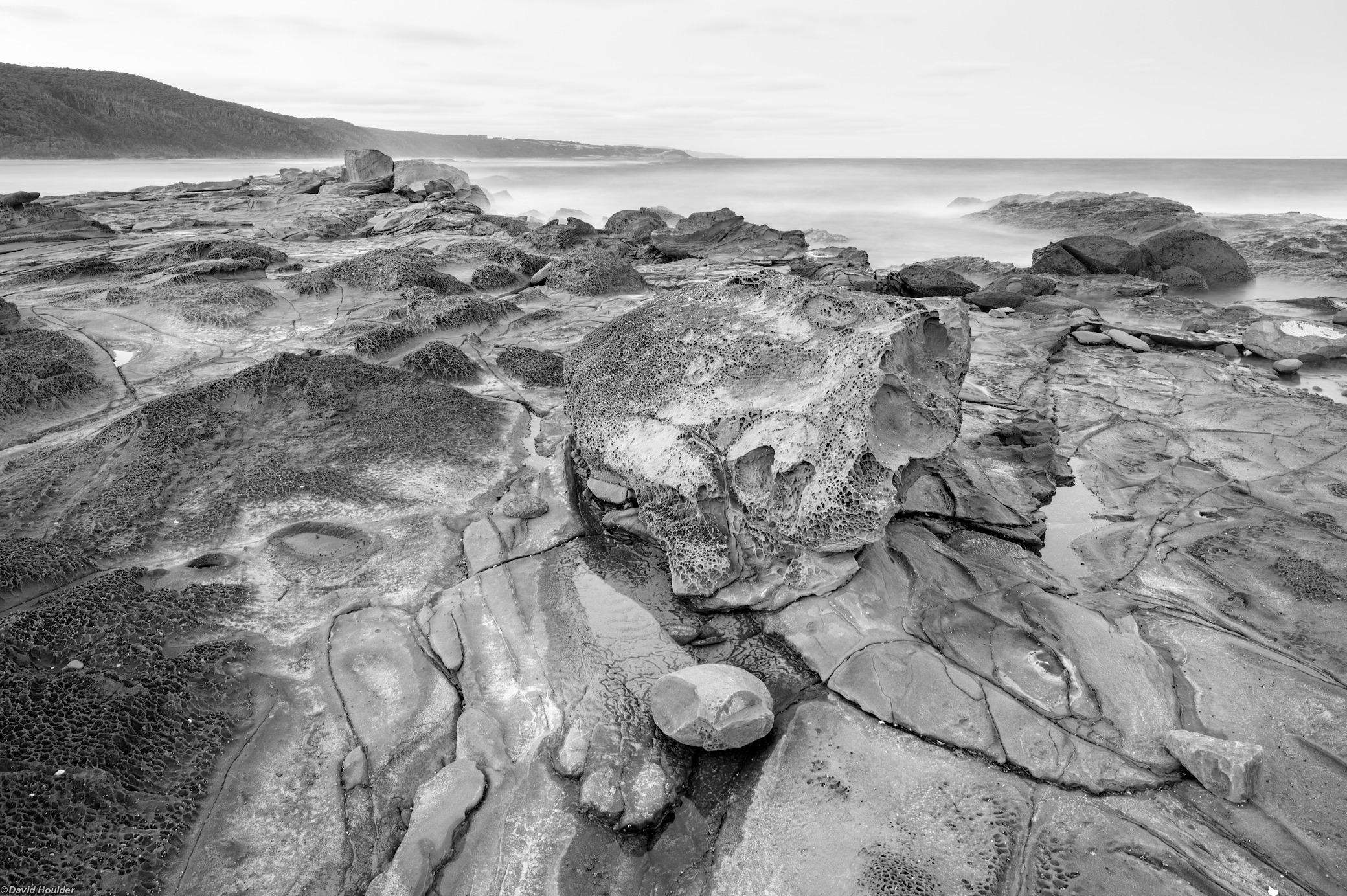 Eroded rocks on a rock shelf by the sea
